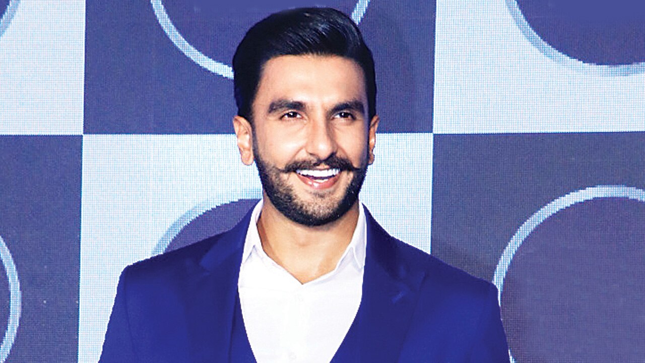 Ranveer Singh oozes charm in a crisp blue suit as he is spotted at the  airport flaunting his sculpted abs : Bollywood News - Bollywood Hungama